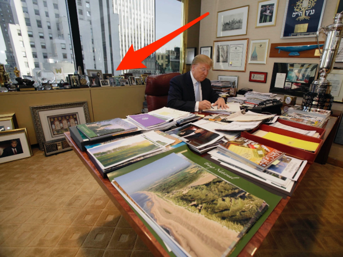 Trump kept a collection of framed family and personal photos behind his old desk.