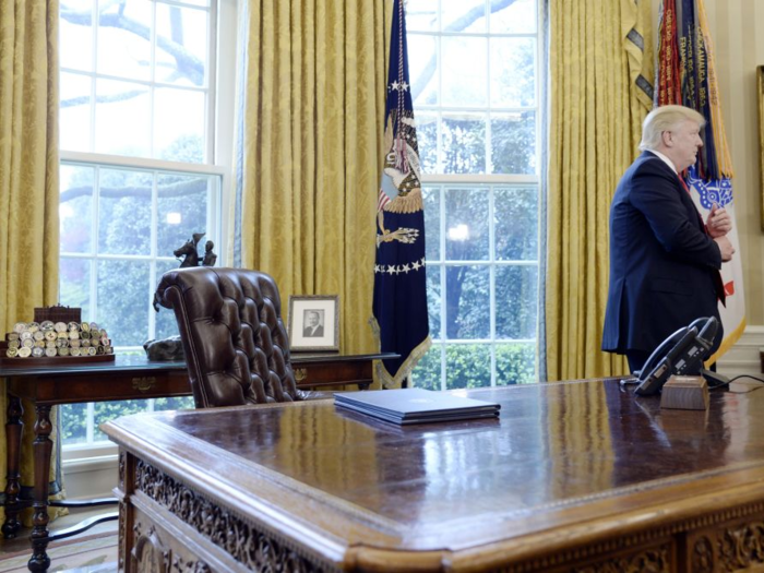 In the Oval Office, he keeps a collection of law enforcement badges on the table behind his desk. Trump also reportedly wanted to display a 1987 letter from former president Richard Nixon, according to The Hill.