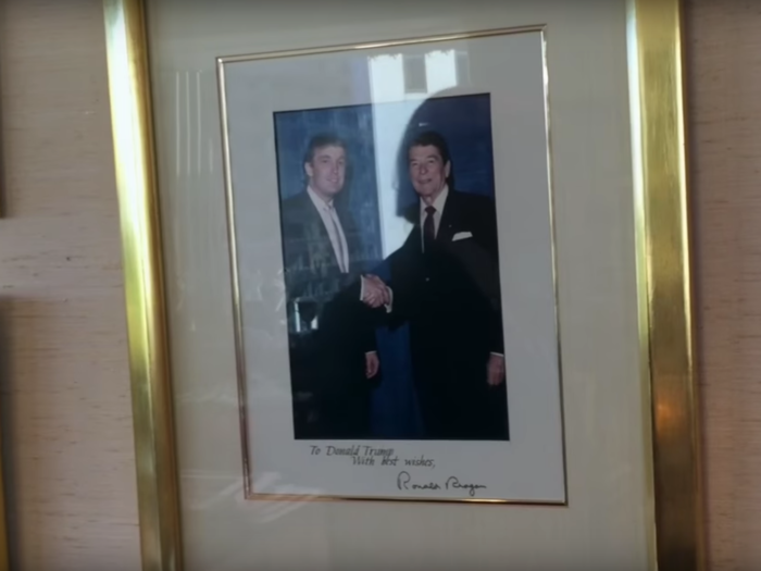 Trump did have at least one presidential photo framed in his old office — a picture of him shaking hands with former US president Ronald Reagan.