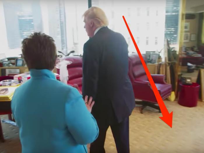 The rug in the Trump Tower office was beige with a square pattern.