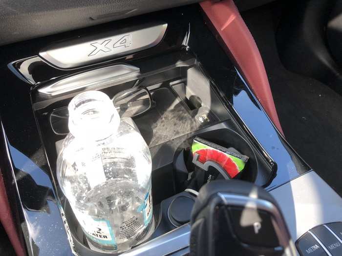 The center console provides a decent amount of storage and a pair of cupholders. BMW