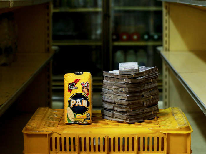 A package of 1kg of corn flour is pictured next to 2,500,000 bolivars, or $0.38.