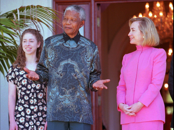 The Clintons met South African President Nelson Mandela in Cape Town. Former President Bill Clinton stayed behind at the White House to recover from knee surgery.