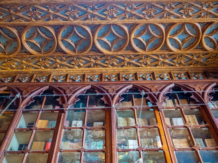 There are even books in glass cases near the top of the ceiling. I wonder if those are just decorative or if they are actually books you can buy. It