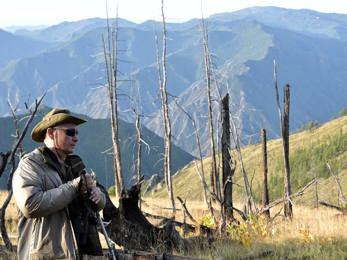 The images showed Putin with top-notch gear for his time in the wildness, including binoculars and trekking poles.