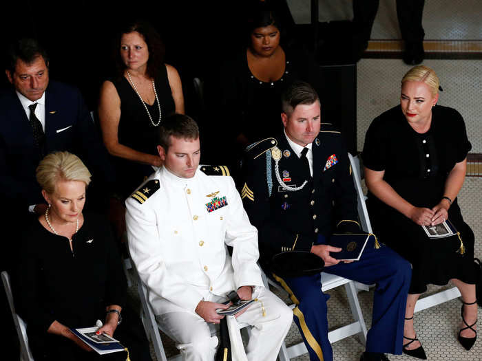 Meghan McCain emotionally looked down the row to her mother for comfort during the ceremony.