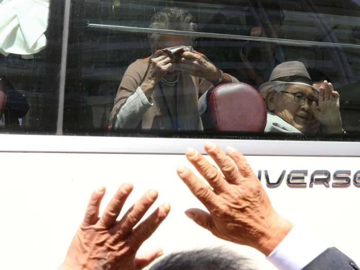 Like many others, Lee cried as she waved her final goodbye through the bus window to her son.