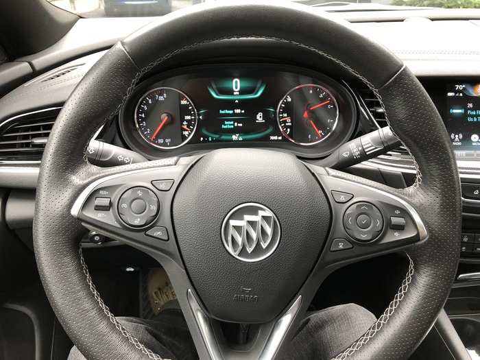 The driver is presented with a pretty basic set of analog gauges and a small information screen in classic Buick blue-green.