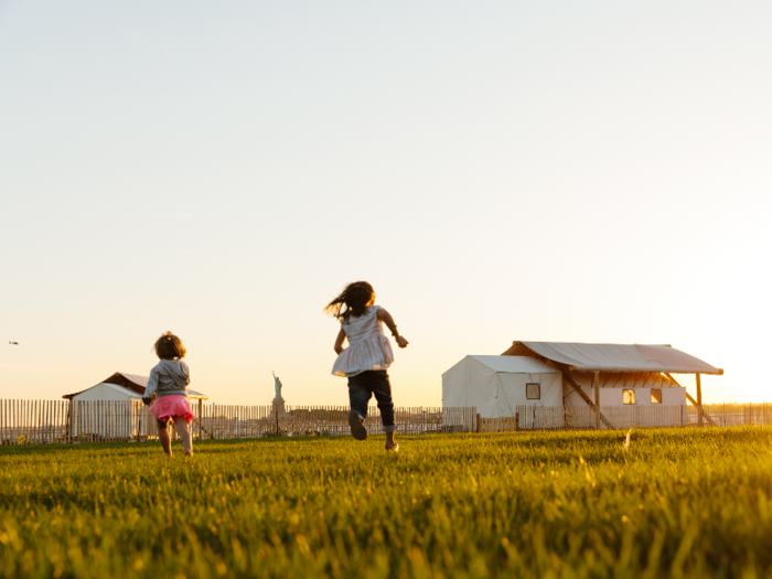 The camp has plenty of open space where kids can run around or adults can relax in the grass.