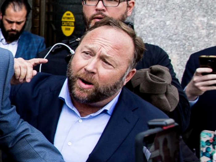 And even Alex Jones has something of the cyborg look to him in this photo: As @manan pointed out, "why does Jones have an iPhone charger connected to his ear?"