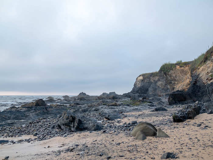 The right side of the beach was marked by jagged black rocks. You couldn