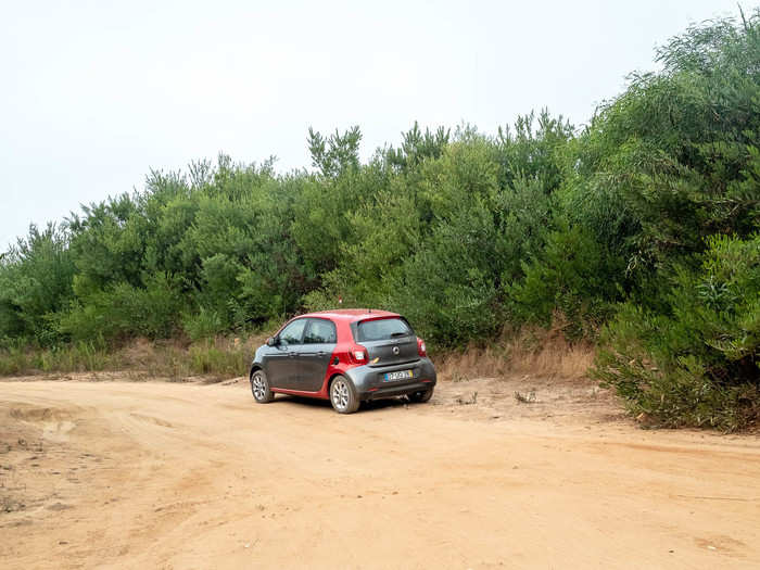 I ended up getting lost driving for twenty minutes trying to follow his directions before I found the road he was talking about. But that road too was sand and far more secluded. I was terrified of getting the dinky SmartCar stuck in the sand again so I parked.