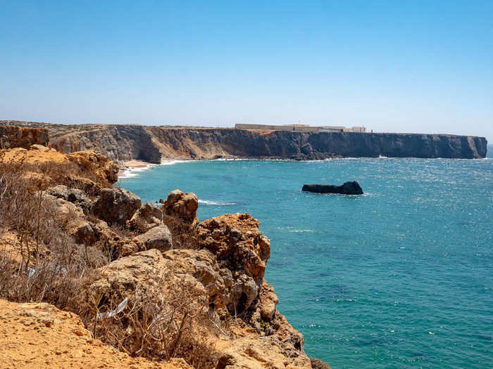 But rather than stick around, I kept driving along the coastline. The western part of the Algarve is known for being less developed. It is lined with jagged cliffs that drop into impossibly blue waters.