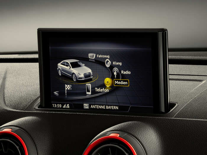 The center stack is dominated by a seven-inch TFT screen running Audi