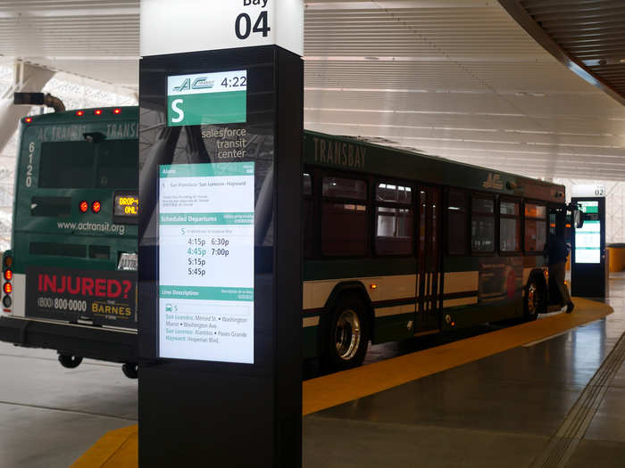 A digital display in each bay shows expected arrival times.