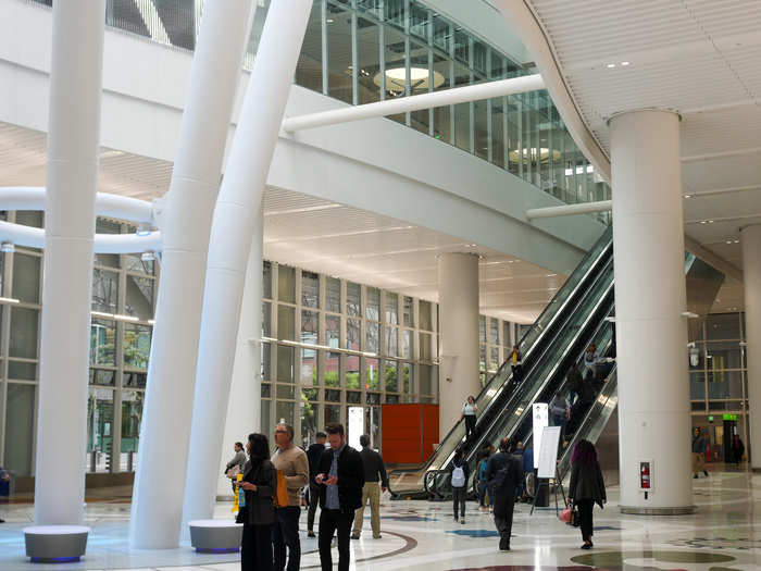 Ground-level visitors enter into the Grand Hall, which is marked by large skeletal beams.