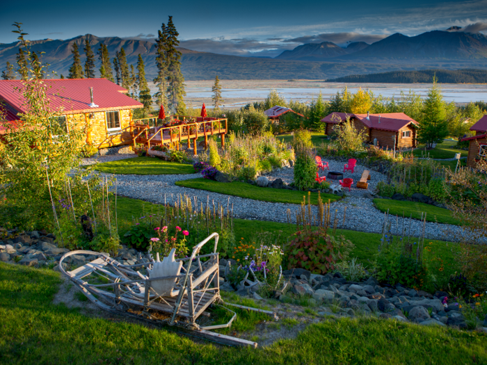 The main lodge sits on top of a hill with five smaller cabins down below.