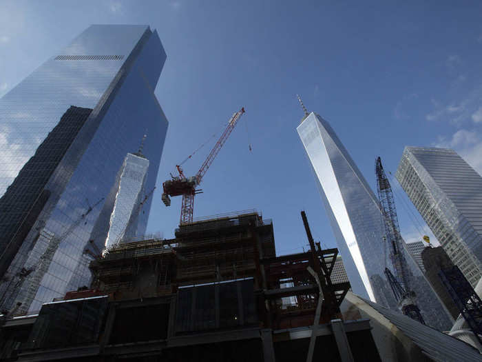 By November 2014, One World Trade Center was completed, as was 4 World Trade Center (left) and 7 World Trade Center (right.) But 3 World Trade Center, seen here with the crane above it, still wasn