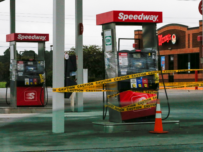 Gas stations are shutting down, and some gas pumps have been wrapped with plastic.