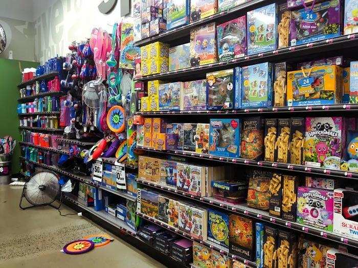 The back of the store was packed with toys and games ...