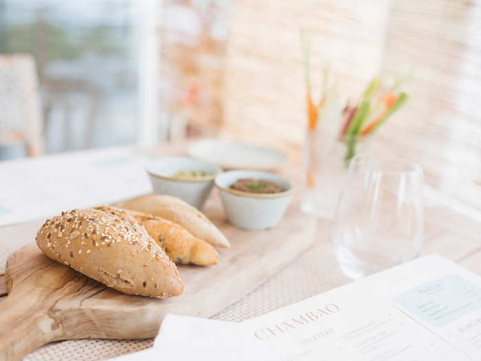 The menu at Chambao tends towards fresh Mediterranean seafood, Valencian paella, and typical tourist beach snacks like burgers and pizza. To start, the waiter brought over three types of bread.