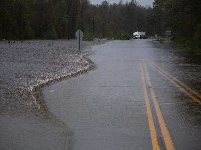 A semi-truck is seen stuck on a flooded highway outside of Jacksonville, North Carolina.