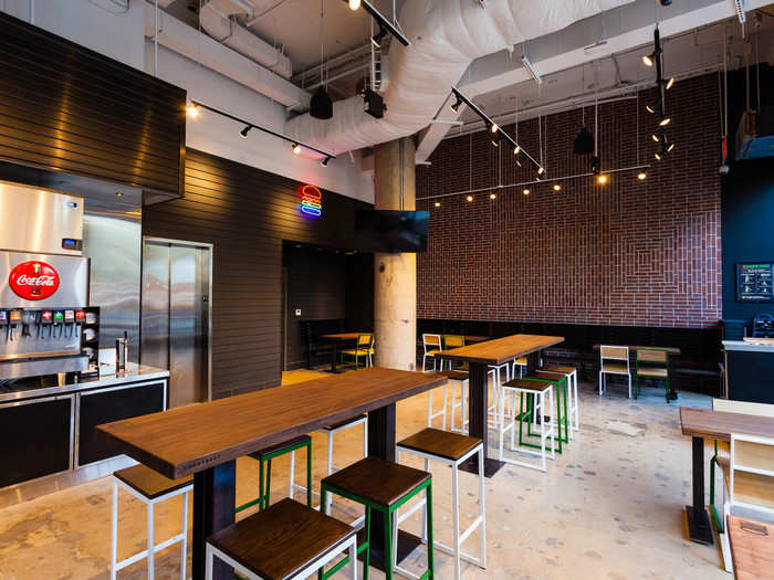 The new Shake Shack is made almost entirely from recycled materials. The table tops are made from reclaimed bowling alley lanes.