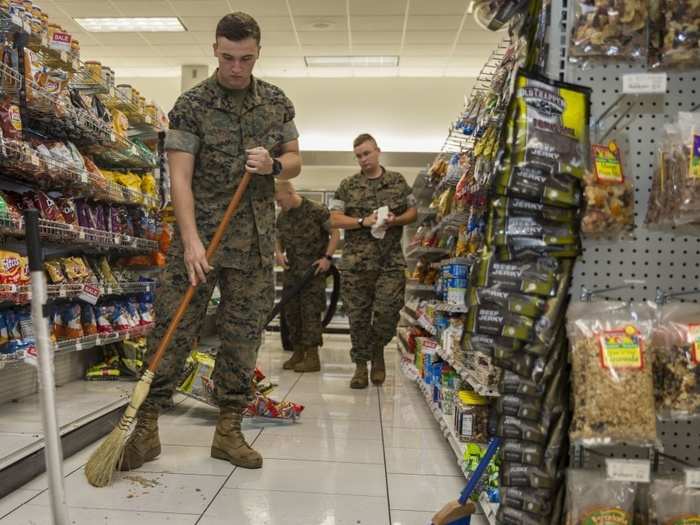 US Marines with Center for Naval Aviation Technical Training conduct post hurricane cleanup at the Marine Corps Exchange on Marine Corps Air Station New River, North Carolina, Sept. 16, 2018.