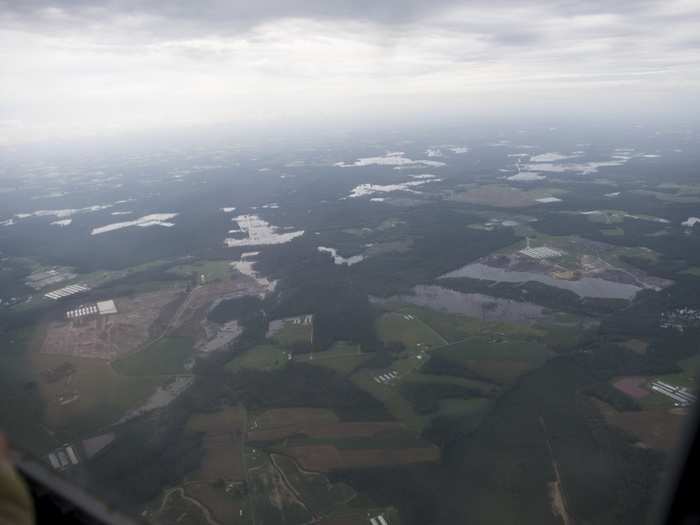 Members from the 106th Rescue Wing New York Air National Guard survey areas affected by severe flooding in Kinston, North Carolina, Sept. 16, 2018