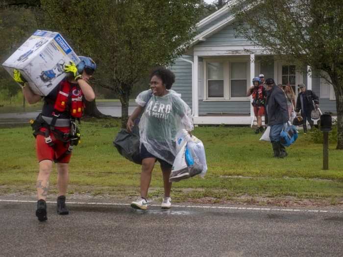 A total of 26 adults, 11 children, seven dogs and four cats were evacuated from the neighborhood.