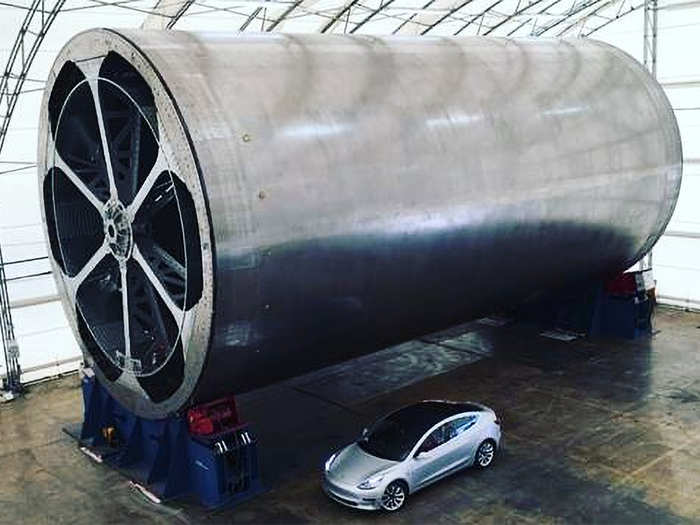 Cylindrical sections are made out of carbon-fiber composites inside the tent — at least until the company finishes a larger, more capable, and permanent facility. This photograph shows a roughly 30-foot-diameter tool in the tent that SpaceX is using to build its BFR sections.