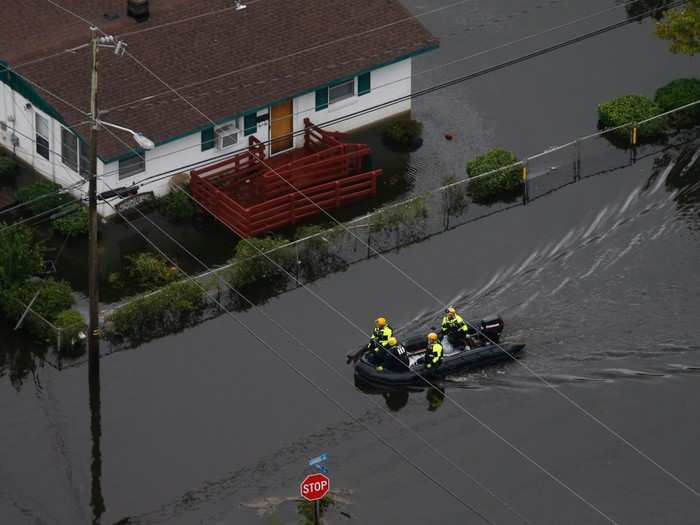 In New Bern, North Carolina, rescue officials used boats and rafts to rescue 455 people trapped in their homes by floods over the weekend.