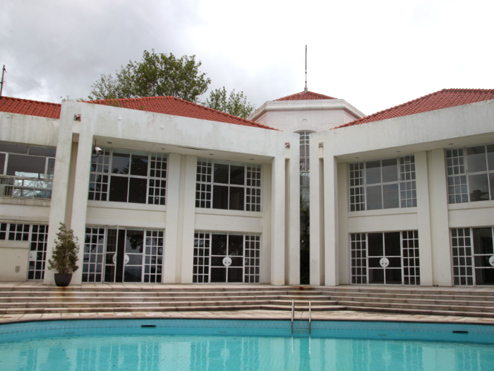 The colonial-style home was built in 1991 and includes an outdoor swimming pool.