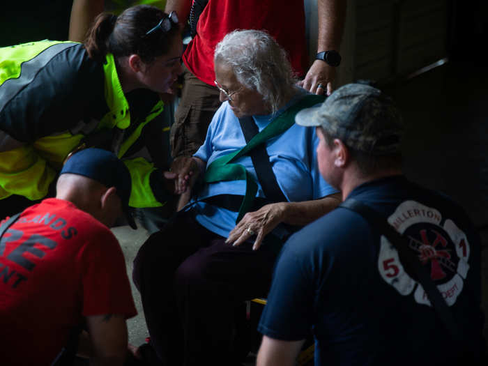 One by one, the Marines and first responders helped the residents into the truck.