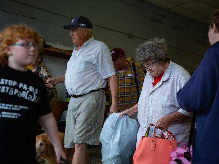 Tamara Corzine (right), along with her husband, two daughters, and two step parents, were six of the 30 residents who had to be rescued.