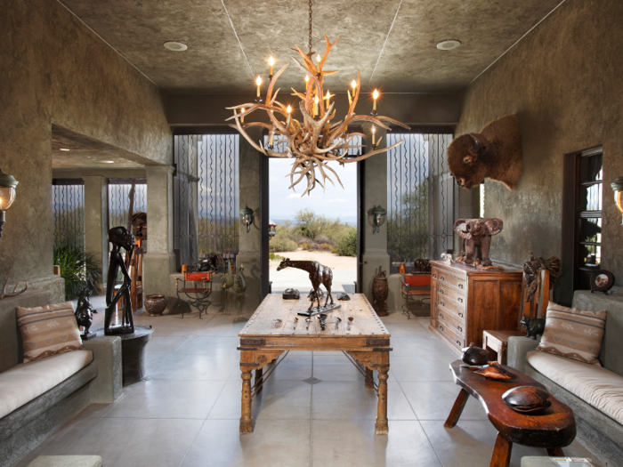 The "Afrizona room" contains touches of African-inspired artwork including giraffe and elephant sculptures.