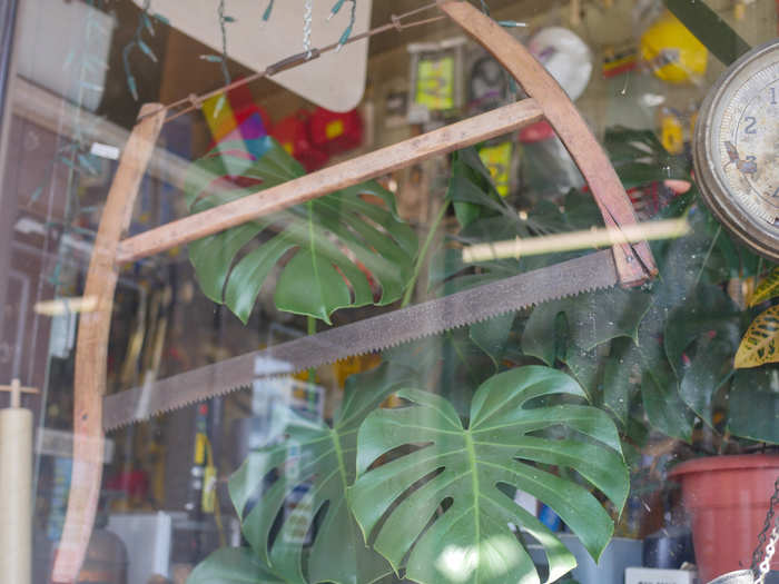 Rusting antique tools and doodads grace the front window displays.