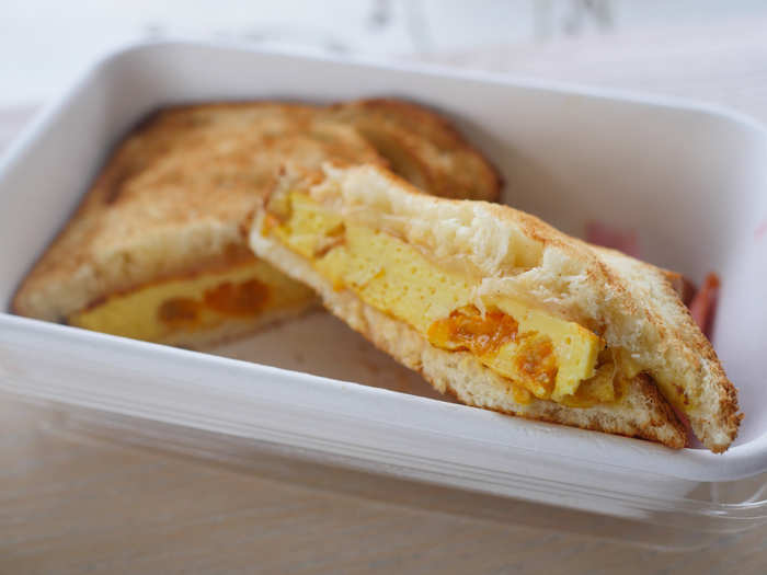 The warm breakfast sandwich came with a whole egg frittata, sun gold tomatoes, and Swiss cheese tucked between slices of toasted milk bread.