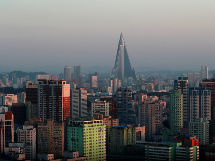 This towering, pyramid-shaped structure nicknamed the "Hotel of Doom" is the currently uninhabited Ryugyong Hotel in Pyongyang, North Korea, which started being built in the 1980s.