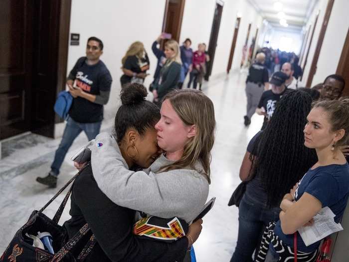 Some of the walkout participants became emotional outside the offices of senators after fellow demonstrators told personal stories of sexual assault.