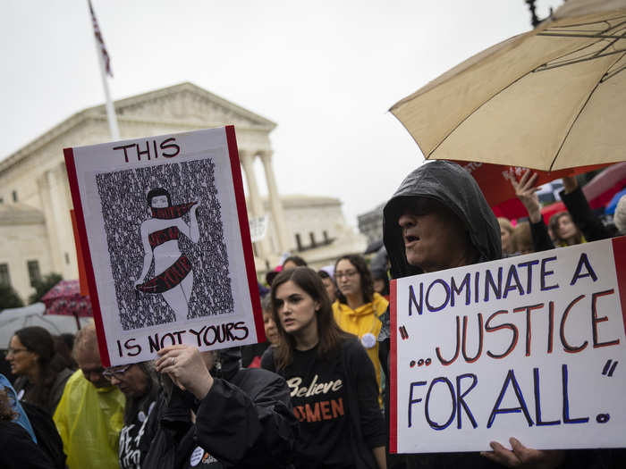 Protesters carried signs that seemed to touch on concerns over Kavanaugh