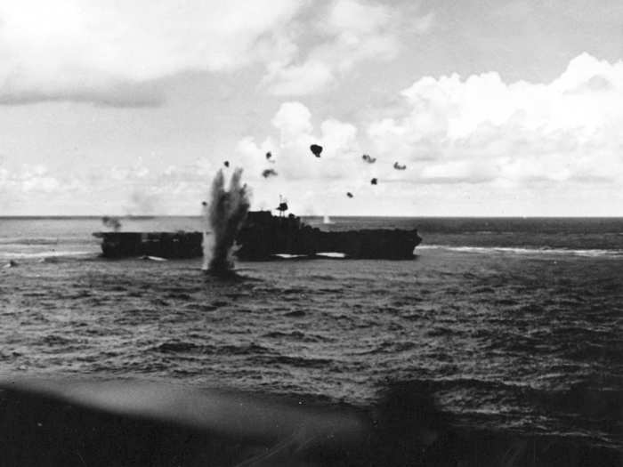 A Japanese Aichi D3A2 bomber barely misses the Big E during the Battle of the Santa Cruz Islands in October 1942.