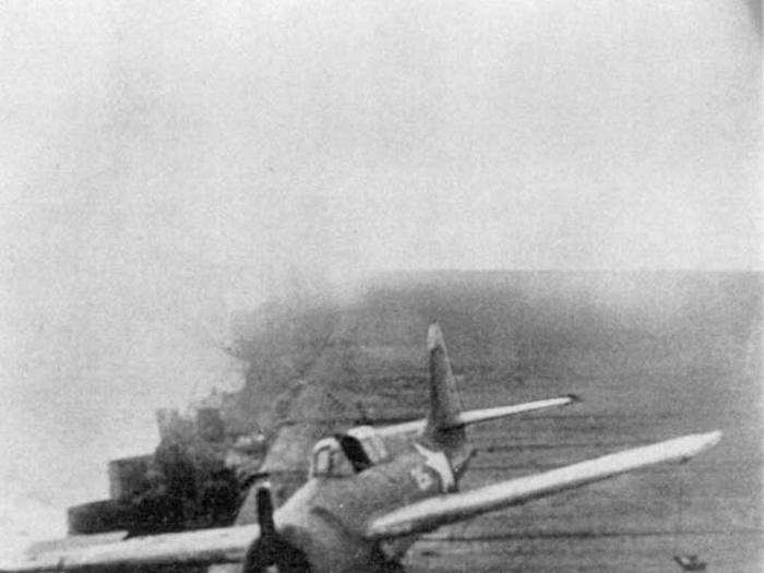 An F4F-4 Wildcat crash lands on the Big E