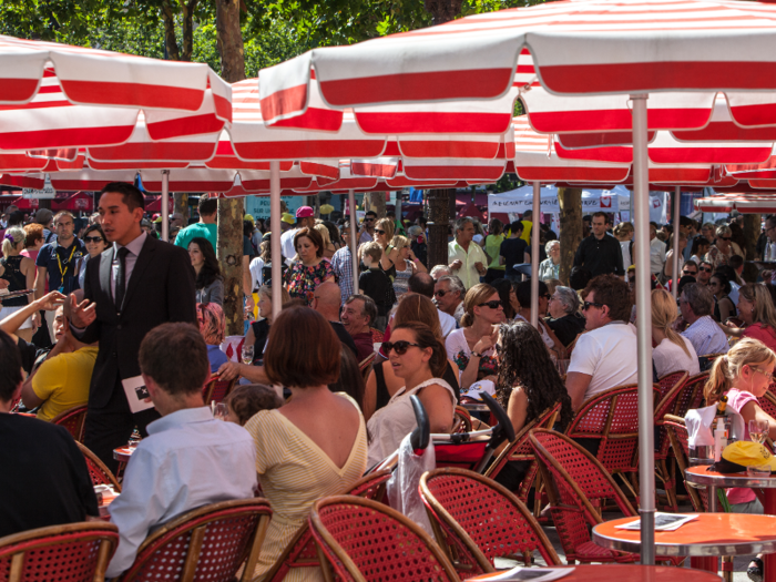 The terraces can be as crowded as the sidewalks. Travel + Leisure included the Champs Elysées on its list of the 95 most overrated attractions in the world, noting that apart from the view of the famous Arc de Triomphe and the stores — most of which can be found in other countries — the avenue has very little appeal.