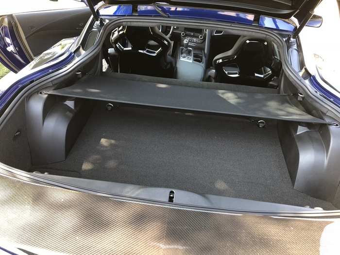 The stow it in a specially designed mount in the trunk, complete with a fabric cover.