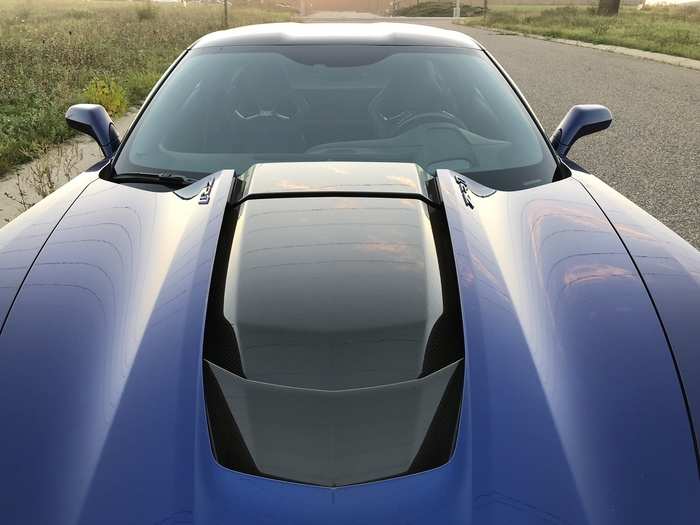 I must report that the massive carbon-fiber hood scoop — which is really part of the engine, not the hood — and the rear wing reduce visibility.