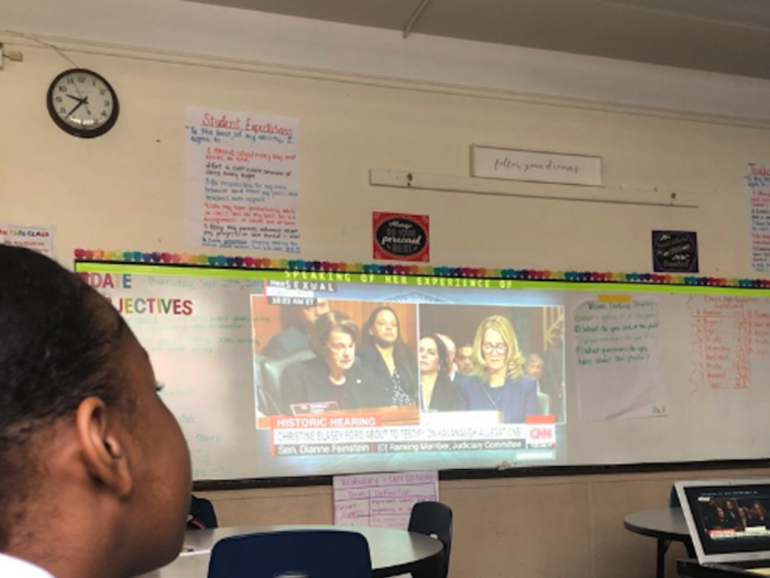 An English teacher in Boston projected the hearing onto her whiteboard so that her students could witness the moment of history.