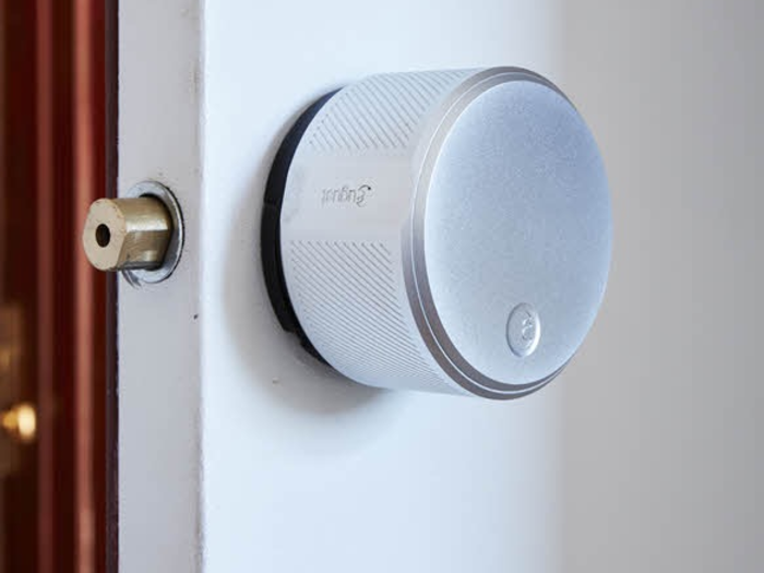 An automated August Smart Lock allows for opening the apartment door with a mobile phone instead of a key.