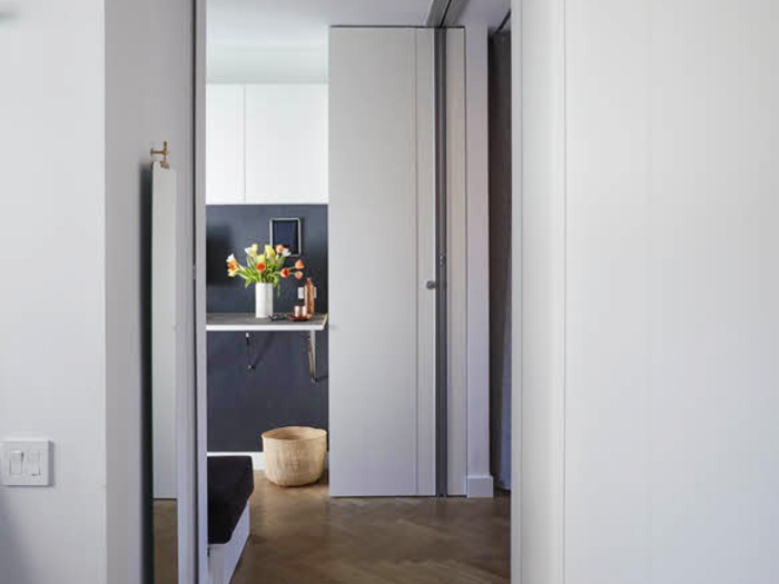 A short hallway leads from the living room to the home office.