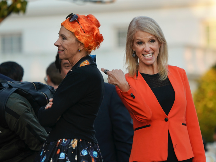 Counselor to the president Kellyanne Conway, wearing a bright orange blazer for the holiday, enjoyed Education Secretary Betsy DeVos